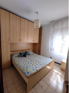 A bed or beds in a room at Cozy studio near the beach - Beahost Még 23 kép