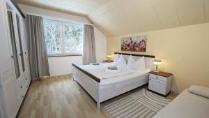 Posteľ alebo postele v izbe v ubytovaní Ferienwohnung Edeltraud, fußläufig zum See und 20 Minuten vom Skigebiet entfernt