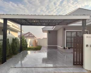 a pergola over a patio of a house at Hua Hin 88 Mountain Retreat - Your Ultimate Family Villa in Hua Hin