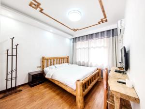 Zhangjiajie YOLO Resort--Within Zhangjiajie National Forest Park客房内的一张或多张床位