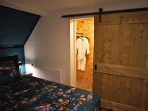 Postel nebo postele na pokoji v ubytování B&B Catharinenburg Golf & Wellness