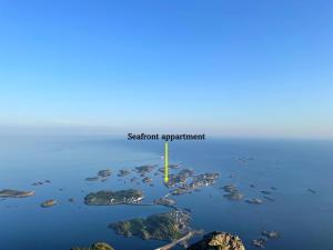 an aerial view of an island in the water at Seafront appartment Henningsvær in Henningsvær