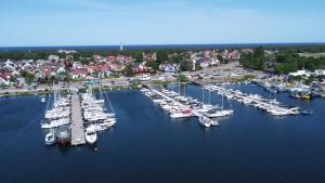 an aerial view of a marina with boats in the water at AVAPARTS Apartament AQUA in Jastarnia