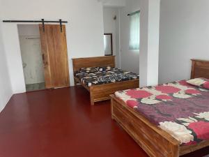 Posteľ alebo postele v izbe v ubytovaní Rahangala edge