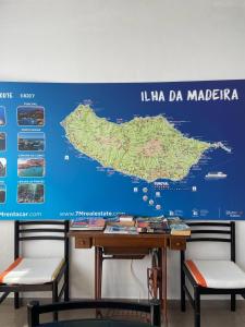 a map of lha madera on a wall at Vila São Gonçalo in Funchal