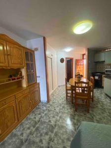 a kitchen with a table and a dining room at Apartment with sea view! Mesa del Mar 120 in Santa Cruz de Tenerife