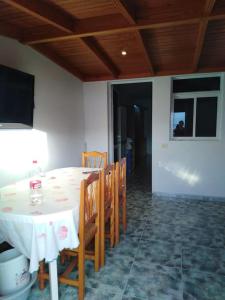 a dining room with a white table and chairs at Apartment with sea view! Mesa del Mar 120 in Santa Cruz de Tenerife +12 photos