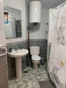 a bathroom with a toilet and a sink at Apartment with sea view! Mesa del Mar 120 in Santa Cruz de Tenerife