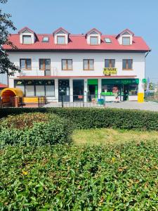 a large white building with a red roof at Apartament Zachodnia Residents in Chełm