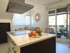 a kitchen with a counter with pumpkins on it at Ático Luz y Mar in Cambados