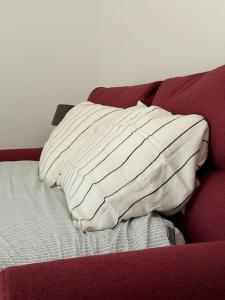 A bed or beds in a room at Marsaxlokk Modern Apartment, Large Backyard