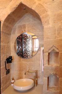 a bathroom with a sink and a mirror at Zabel Hotel in Mardin +32 photos
