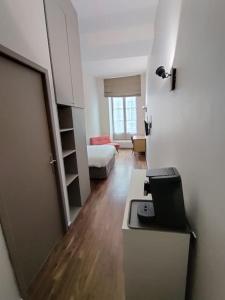 Ένα ή περισσότερα κρεβάτια σε δωμάτιο στο Appartement quartier Chartrons étage 1