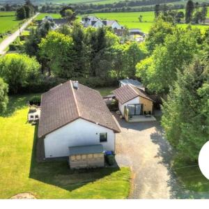 an aerial view of a house with a roof at Little Slioch Cottage- A Break From City Life in Avoch