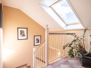 a skylight in a house with a staircase at Hotel Stone in Zingst