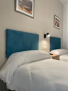 Postel nebo postele na pokoji v ubytování Sueños de Lorca Guest House