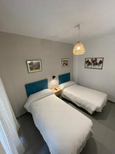 Postel nebo postele na pokoji v ubytování Sueños de Lorca Guest House