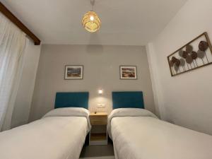Postel nebo postele na pokoji v ubytování Sueños de Lorca Guest House
