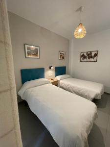 Postel nebo postele na pokoji v ubytování Sueños de Lorca Guest House