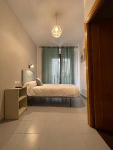 Postel nebo postele na pokoji v ubytování Sueños de Lorca Guest House