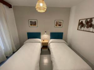 Postel nebo postele na pokoji v ubytování Sueños de Lorca Guest House