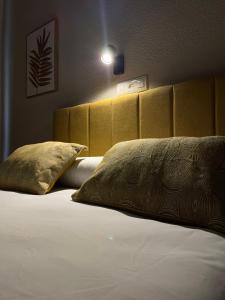 Postel nebo postele na pokoji v ubytování Sueños de Lorca Guest House