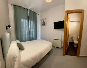 Postel nebo postele na pokoji v ubytování Sueños de Lorca Guest House