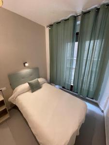 Postel nebo postele na pokoji v ubytování Sueños de Lorca Guest House