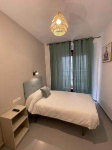 Postel nebo postele na pokoji v ubytování Sueños de Lorca Guest House