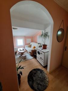 een woonkamer met een bank en een tafel bij Apartment DUNJA in Pluzine