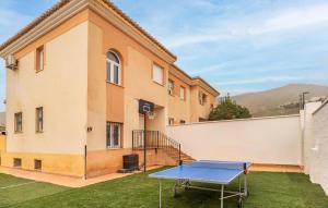 a ping pong table in front of a building at 3 Bedroom Amazing Home In Padul in Padul +19 photos