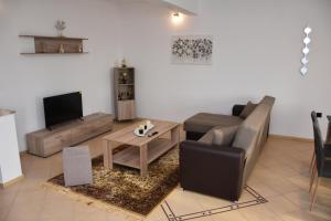 a living room with a couch and a table at Casa Valesa in Skala Sotiros