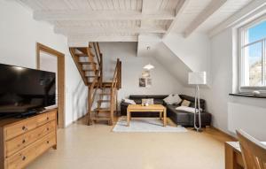 a living room with a couch and a television at 2 Bedroom Gorgeous Apartment In Pommern in Pommern