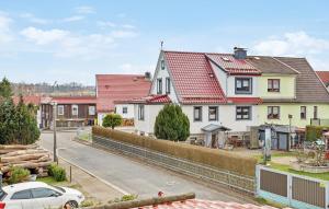 a row of houses with red roofs on a street at Amazing Apartment In Benneckenstein With Kitchen in Benneckenstein