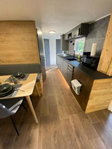 a kitchen with a table and a counter top at DeerN'Wood in Trois-Ponts
