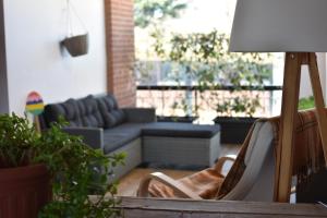 a living room with a couch and a chair at The Piedmont Gate in Collegno