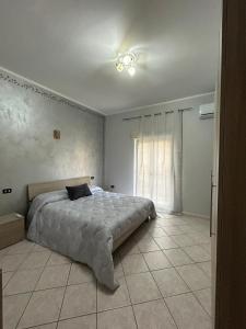 Katil atau katil-katil dalam bilik di Casa Vacanze Suli e Mari +2 gambar