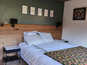 a bedroom with a large bed with two pillows at Chalet Valloire, 7 pièces, 14 personnes - FR-1-263-532 in Valloire