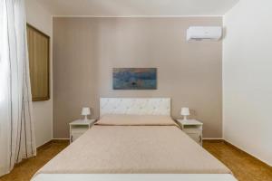 Postel nebo postele na pokoji v ubytování Casa vacanze Tafuro
