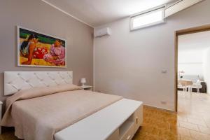 Postel nebo postele na pokoji v ubytování Casa vacanze Tafuro