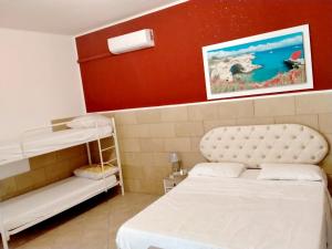 Postel nebo postele na pokoji v ubytování Casa vacanze Tafuro