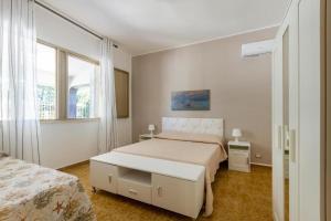 Postel nebo postele na pokoji v ubytování Casa vacanze Tafuro