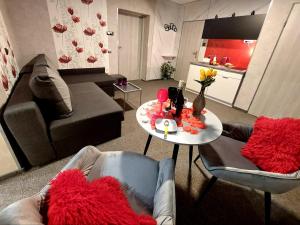 a living room with a couch and a table at Hortensja 309 in Koszalin +29 photos