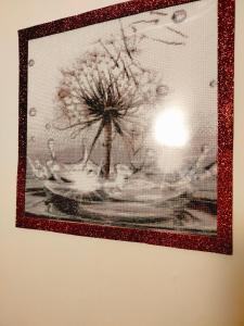 a black and white picture of a flower on a wall at Dandelion home Viareggio centro in Viareggio