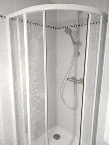 a shower in a bathroom with a glass door at Casa Marina - Le Petit Bleu Vue mer in Pornic +19 photos