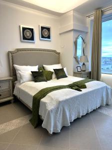 a bedroom with a large bed with a large window at Panorama Apartments Vienna in Vienna +194 photos