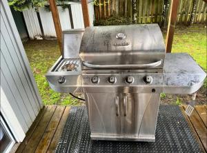 a grill and a stove and a sink on a porch at Private level of the house with SPA in Gresham