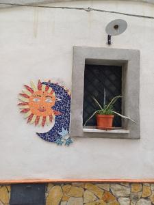 a painting of a cat on the side of a building at Etnalcantara16 in Castiglione di Sicilia