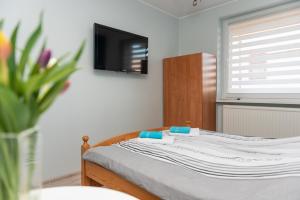 Postel nebo postele na pokoji v ubytování Pokoje Gościnne Skaut