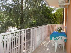 A balcony or terrace at Furnished apartment near the beach
